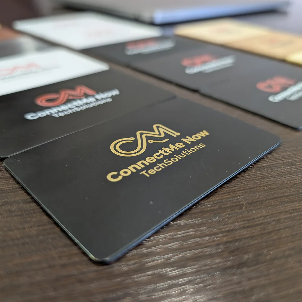Matt black NFC card with gold logo close-up